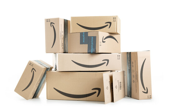 Amazon Prime cardboard boxes stacked and isolated on white background.