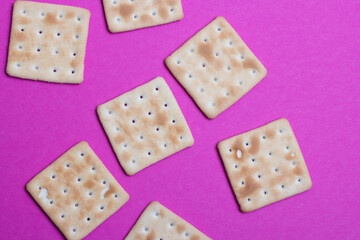 cracker cookies on a pink background