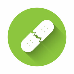 White Broken skateboard deck icon isolated with long shadow background. Extreme sport. Sport equipment. Green circle button. Vector
