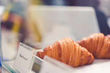 Fresh french croissant chocolate on bakery restaurant cafe on black table.restaurant bakery menu.Sweet dessert.breakfast food, baked croissant.Homemade croissants on bakery cafe.fresh bakery.Dessert.