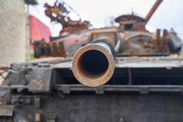 Fototapeta na wymiar Broken tanks, combat vehicles and other burnt military equipment of the Russian invaders in Ukraine