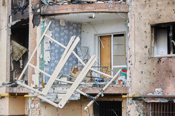 War of Russia against Ukraine. Residential building damaged by enemy aircraft in Ukrainian. Consequences of war, damaged grocery market by troops of Russian army. private house destroyed.