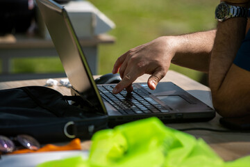 Man working with his computer outdoors