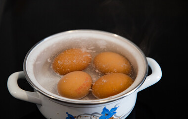 four eggs boiling for breakfast