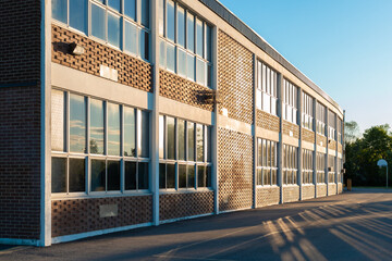 School building and school yard in the evening