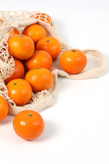 Oranges, healthy fruits, mandarin oranges, vitamin C, oranges in a knitted bag, bought from the market
