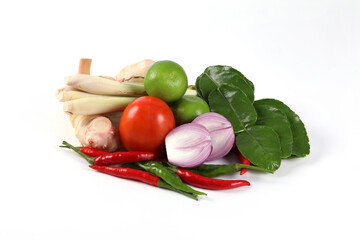 Tom Yum spices ingredients, spices, Thai food, Thai soup on white background. Lemongrass, galangal, lime, red onion, fresh chili, kaffir lime leaves, mushroom, parsley, tomato, lemon.