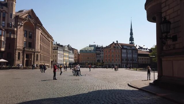 Overview of Dome Square in Riga, Latvia. Pan right