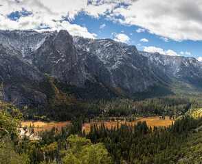 Upper Yosemite Falls wide angle view - Snow covered mountain range over Yosemite Valley