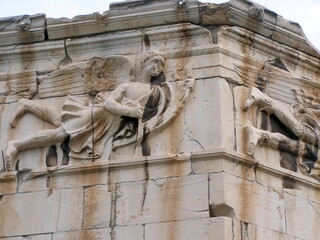Bas relief carving on a wind tower in an archaeological park in Athens, Greece