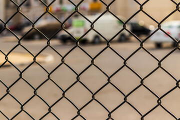 Fototapeta premium Close up shot of a netting fence. Outdoors