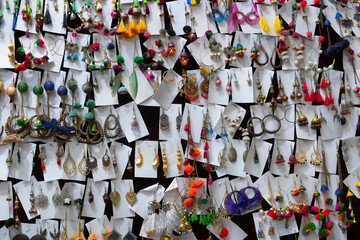 Various colorful shapes and shades of earrings , handicrafts on display at Jaisalmer city, Rajsathan, India.