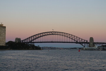 Fototapeta na wymiar Sunset in Sydney Harbour Bridge in Australia. Travelling during corona pandemic.