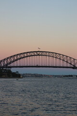 Fototapeta na wymiar Sunset in Sydney Harbour Bridge in Australia. Travelling during corona pandemic.