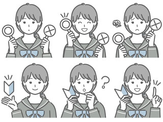 〇✕マークや初心者マークを持つ女子学生
