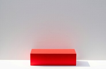 Red podium stage box with sunlight shadow on white backdrop base for product display stand.