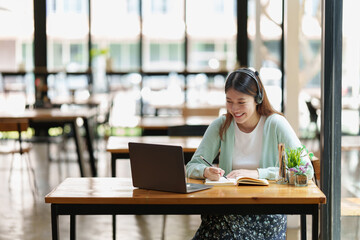 Fototapeta premium Young college student have question and answer to teacher by video call E-learning ,online ,education concept