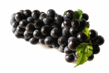 black grape fruit with green leaves isolated on white background