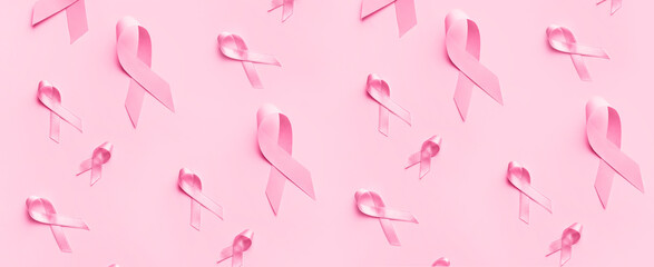 Many pink ribbons on color background. Breast cancer awareness concept - Powered by Adobe