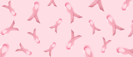 Many pink ribbons on color background. Breast cancer awareness concept