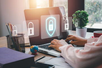Cyber security concept, Business woman hand using computer with padlock security interface to...