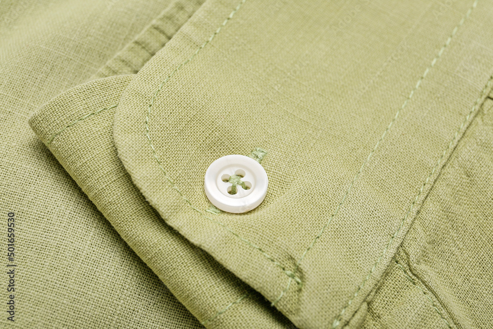 Poster Closeup view of button on linen male shirt