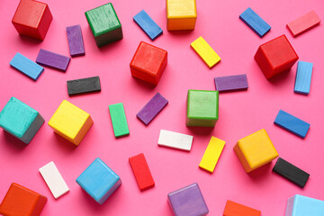 Fototapeta na wymiar Colorful cubes with blocks on pink background