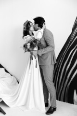 Wedding beautiful young couple kissing. Black and white photo