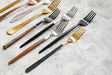 Many different forks on light background