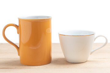 Mug and cup on wooden table