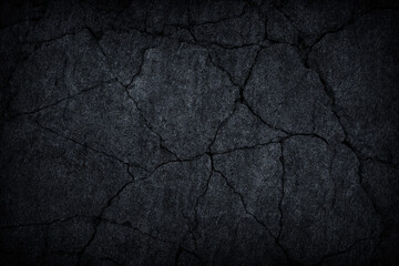 Dark grey black slate stone crack background or texture