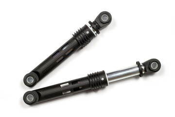 Two shock absorbers for the washing machine on a white background.