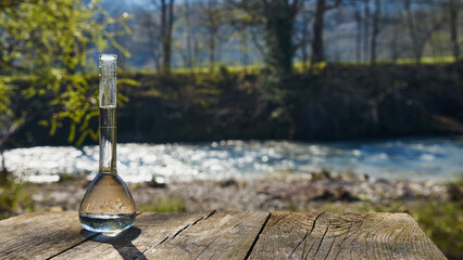 Fototapeta na wymiar Glass flask with clean drinking water.