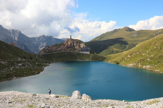 Enchanting mountain landscape of the European Alps with an alpine lake called LAGO VOLAIA formed by the melting of the glacier