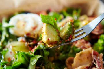 Fototapeta na wymiar fresh salad on fork