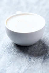 Coffee with milk on wooden background. Close up. Copy space.	
