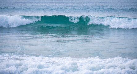Ocean or sea tropical waves. Ocean background, seascape. Tropical beach with wave, nature background. Copy space of summer vacation and travel concept.