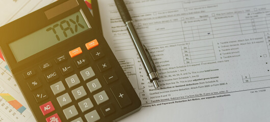 Tax words and numbers 2022 on the calculator Business and tax ideas. Pay taxes in 2022. New year 2022 tax ideas.