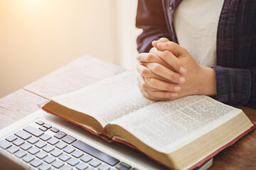 The Bible is in hand, praying by hand and praying together. with religious faith and belief in god on blessing background The power of hope or love and devotion.