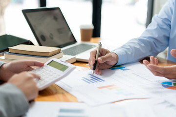 Business negotiation concept the female broker estimating the number of estate and checking it with the male broker