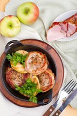 Fried salo with grilled apple, Ukrainian cuisine. Photo of food on a white background