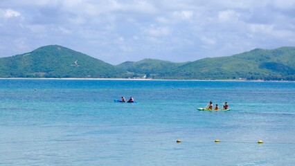 Fototapeta na wymiar People kayaking in the beautiful sea. Activities on the water, sport and recreation.