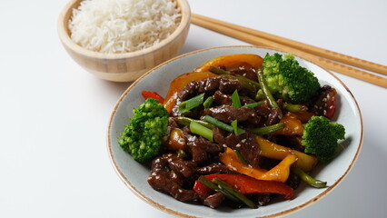 Mongolian meat in sauce with rice. Mongolian barbecue with meat and vegetables in Thai restaurant