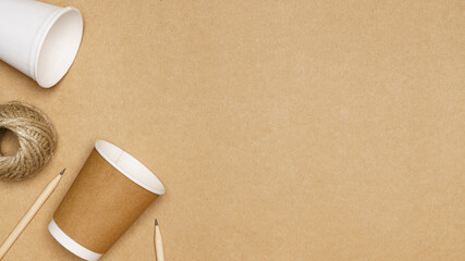 Eco friendly concept, Consist of paper cup and jute rope with pencil on wooden background