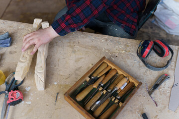 carpentry tools lie in a case on the table