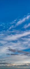 Fantastic clouds against blue sky, panorama