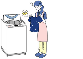 ティッシュを一緒に洗濯してしまい困る女性