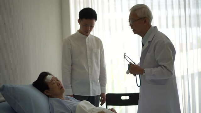 Doctor tell senior patient condition to family, son, medical planning and treatment discussion