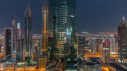 Financial center of Dubai city with luxury skyscrapers night to day timelapse, Dubai, United Arab Emirates