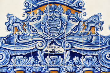 detail of the decoration in azulejos tiles around the windows on the facade of old railways station in Aveiro, Portugal